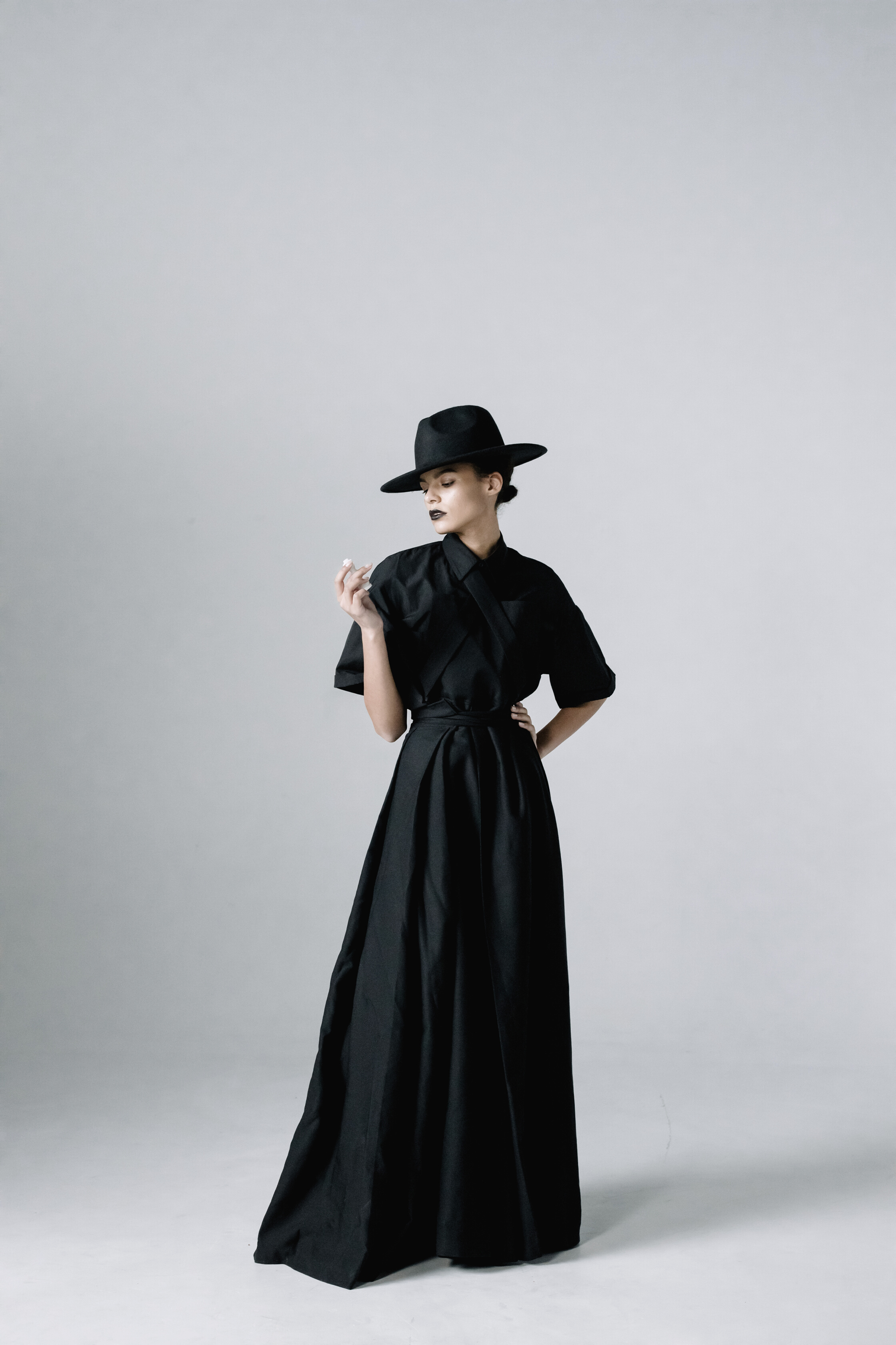 A Woman in a Black Dress Posing